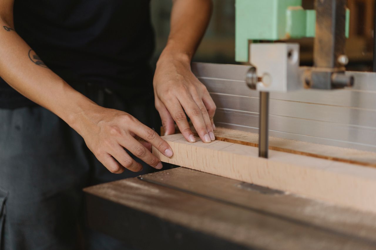 The Art of Drawing Readers In: Your attractive post title goes here Crop anonymous male joiner sawing wooden block with electric machine on table in workroom